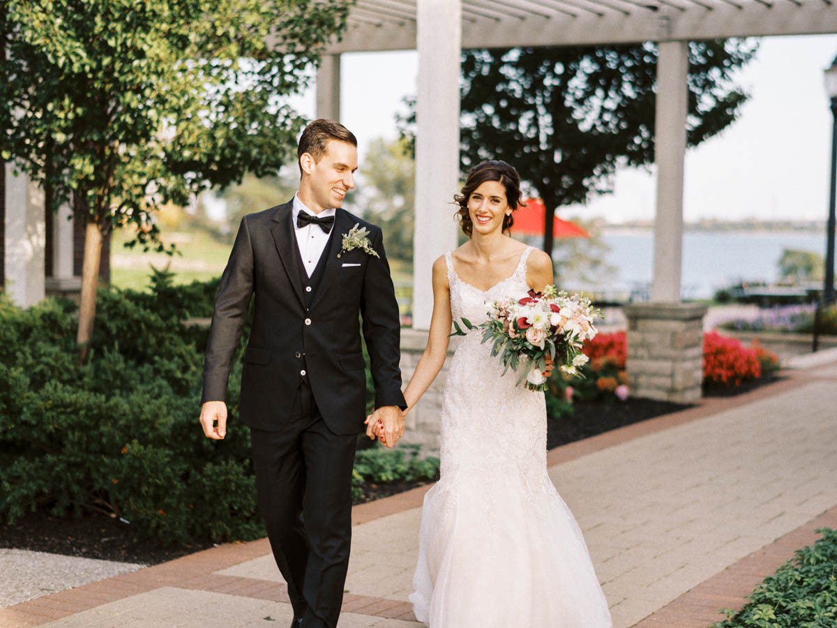bride and groom walking and smiling, burlington golf and country club wedding