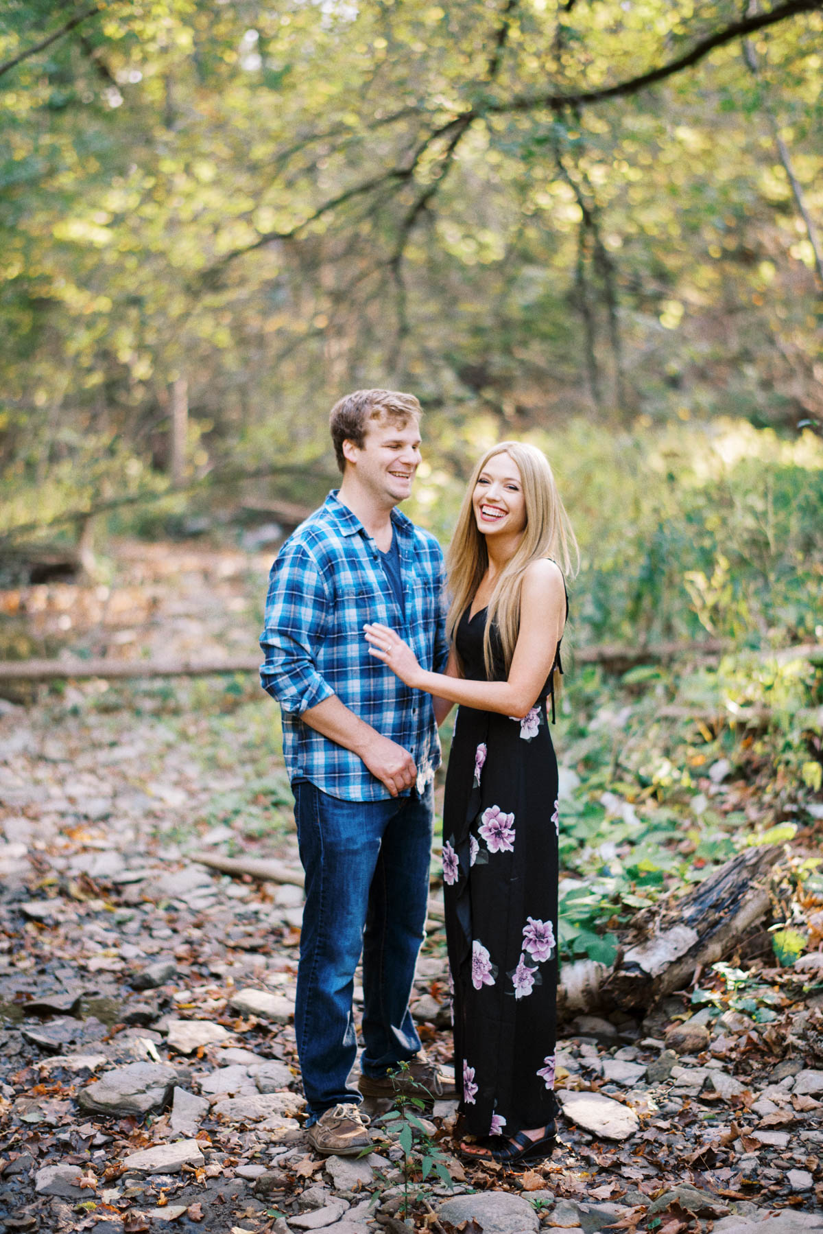 a couple laughing at the photographer and each other during a georgetown engagement session