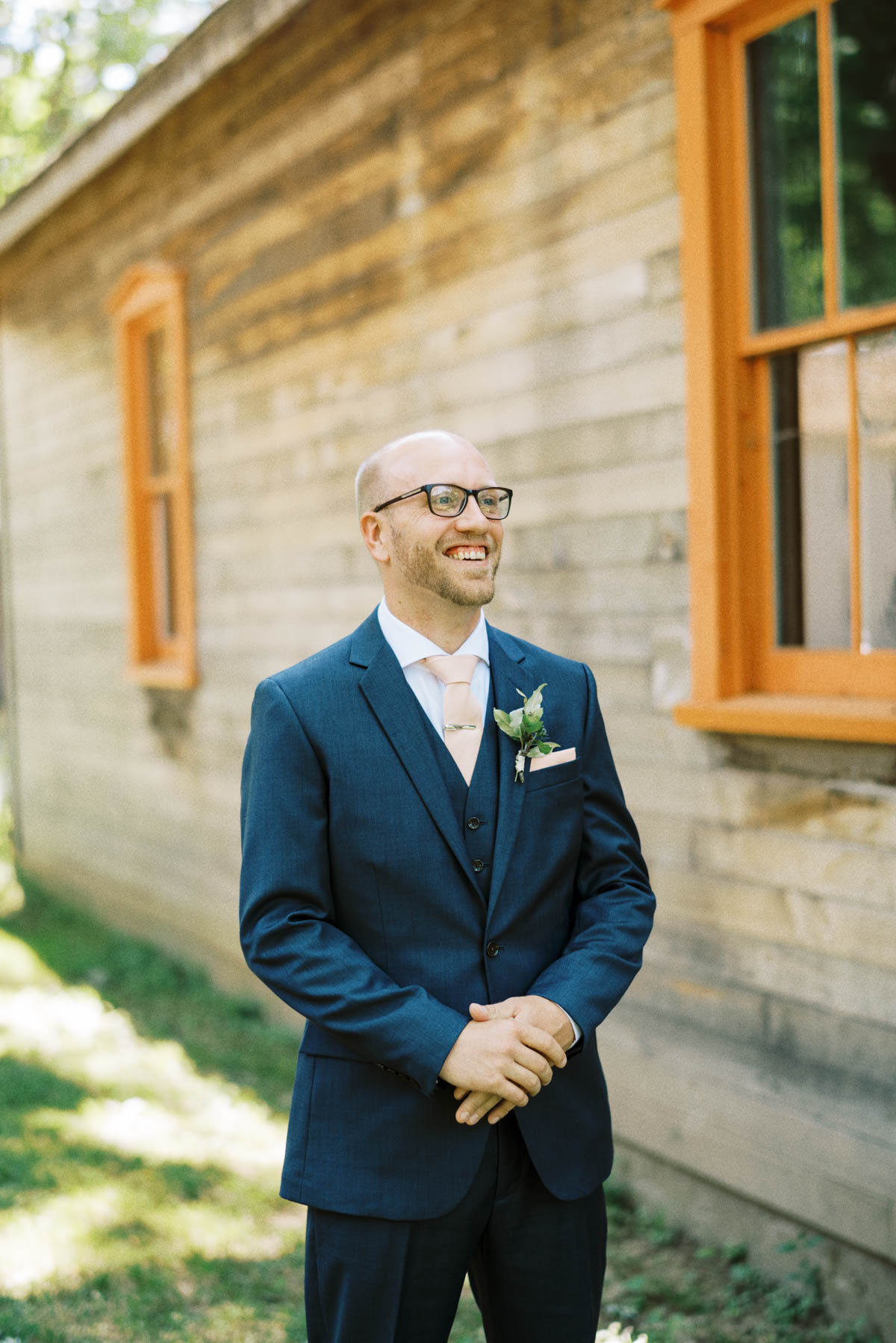 groom before the first look during a wedding at fanshawe pioneer village in london