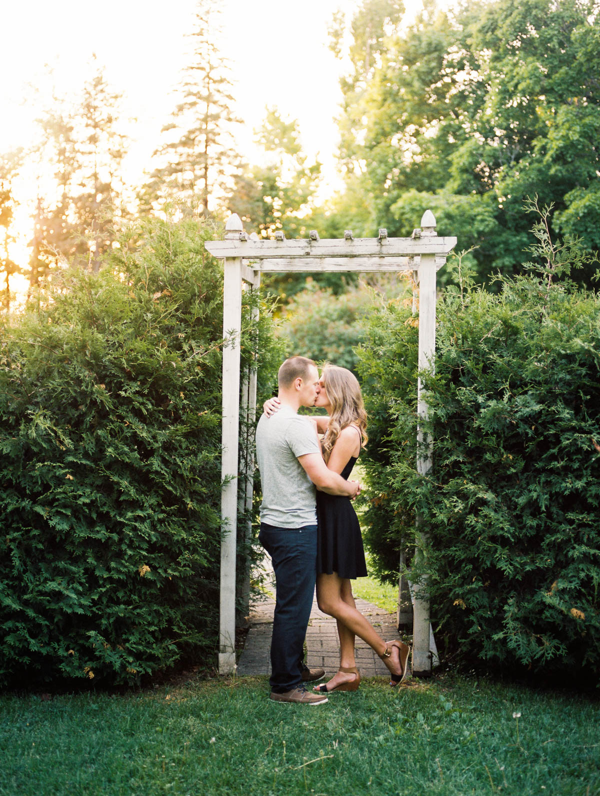 kissing during an engagement session at scotsdale farm